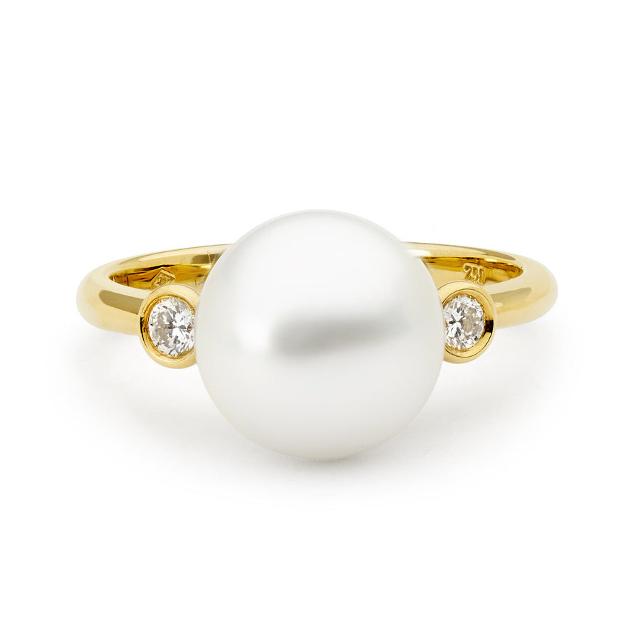 Yellow gold pearl and diamond ring with bezel set diamonds