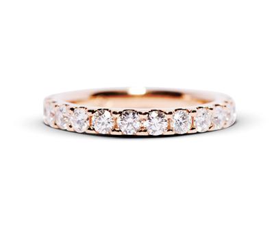 Shared claw set diamond ring